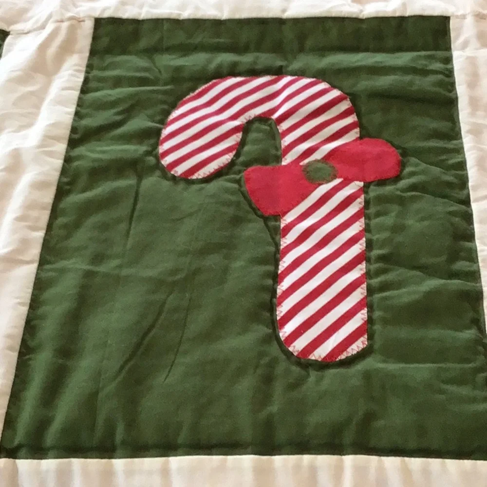 Handmade Christmas-themed applique quilt